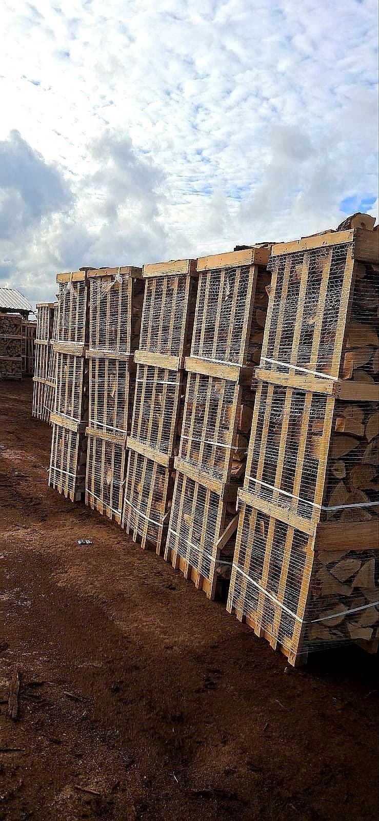 Firewood crate storage rows in a yard facility