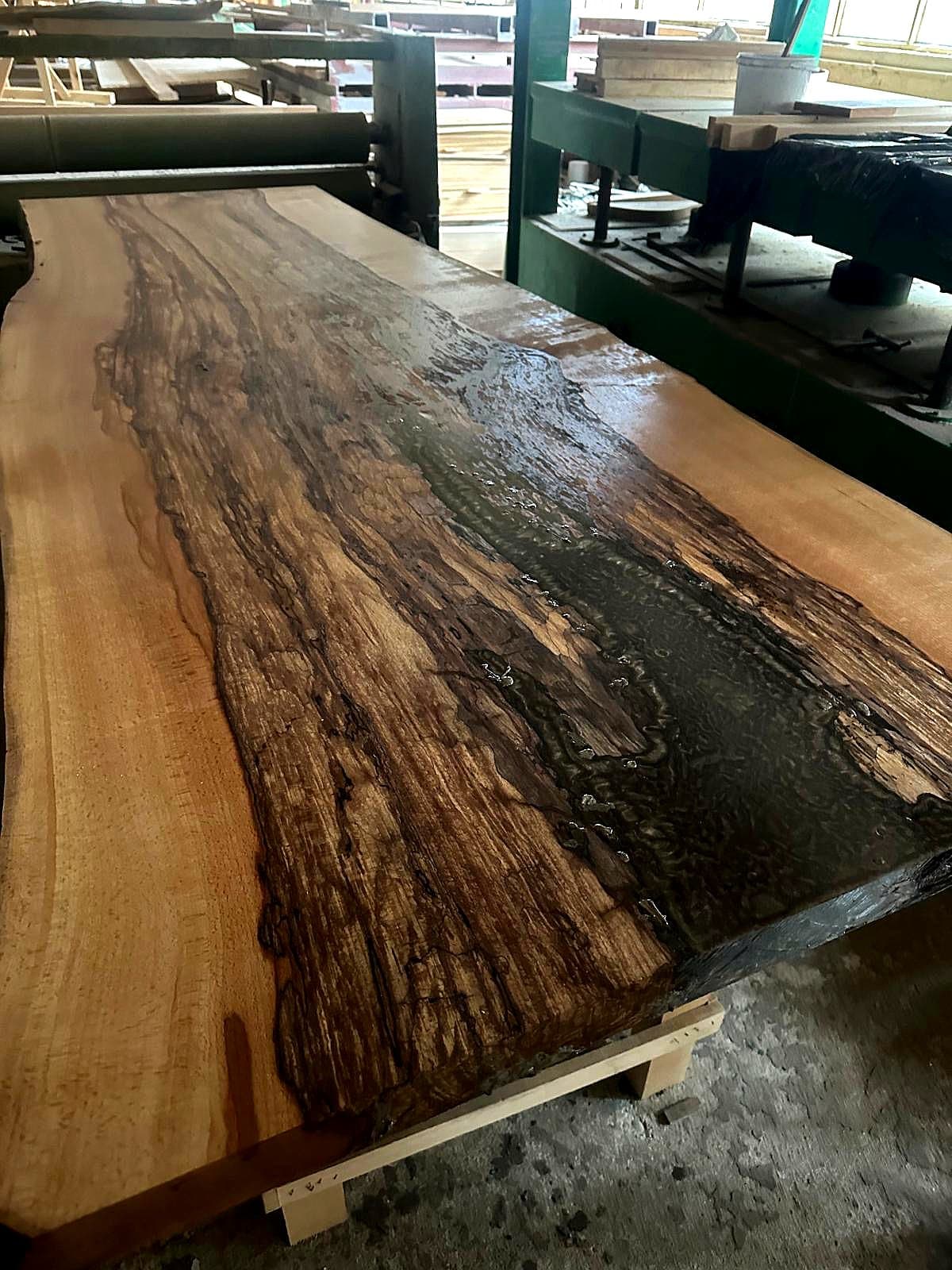 Bespoke oak dining table with final finish showcasing natural wood beauty