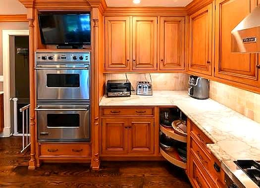 Side panels for kitchen cabinet construction