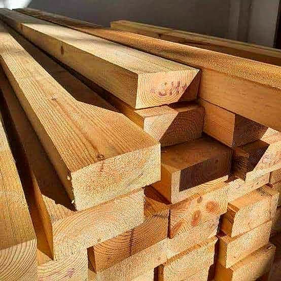 Rough timber planks in workshop for custom processing